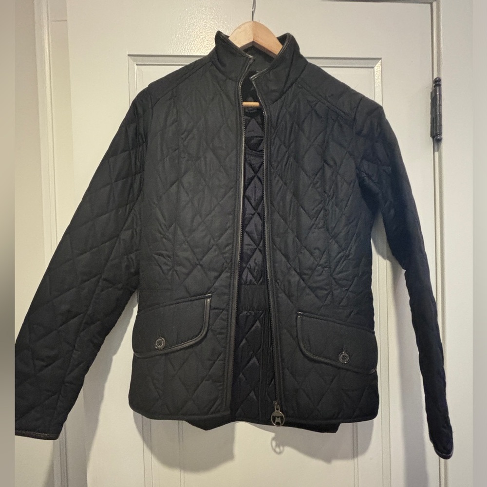 Barbour Women’s Coat quilted dark navy with leather trim.